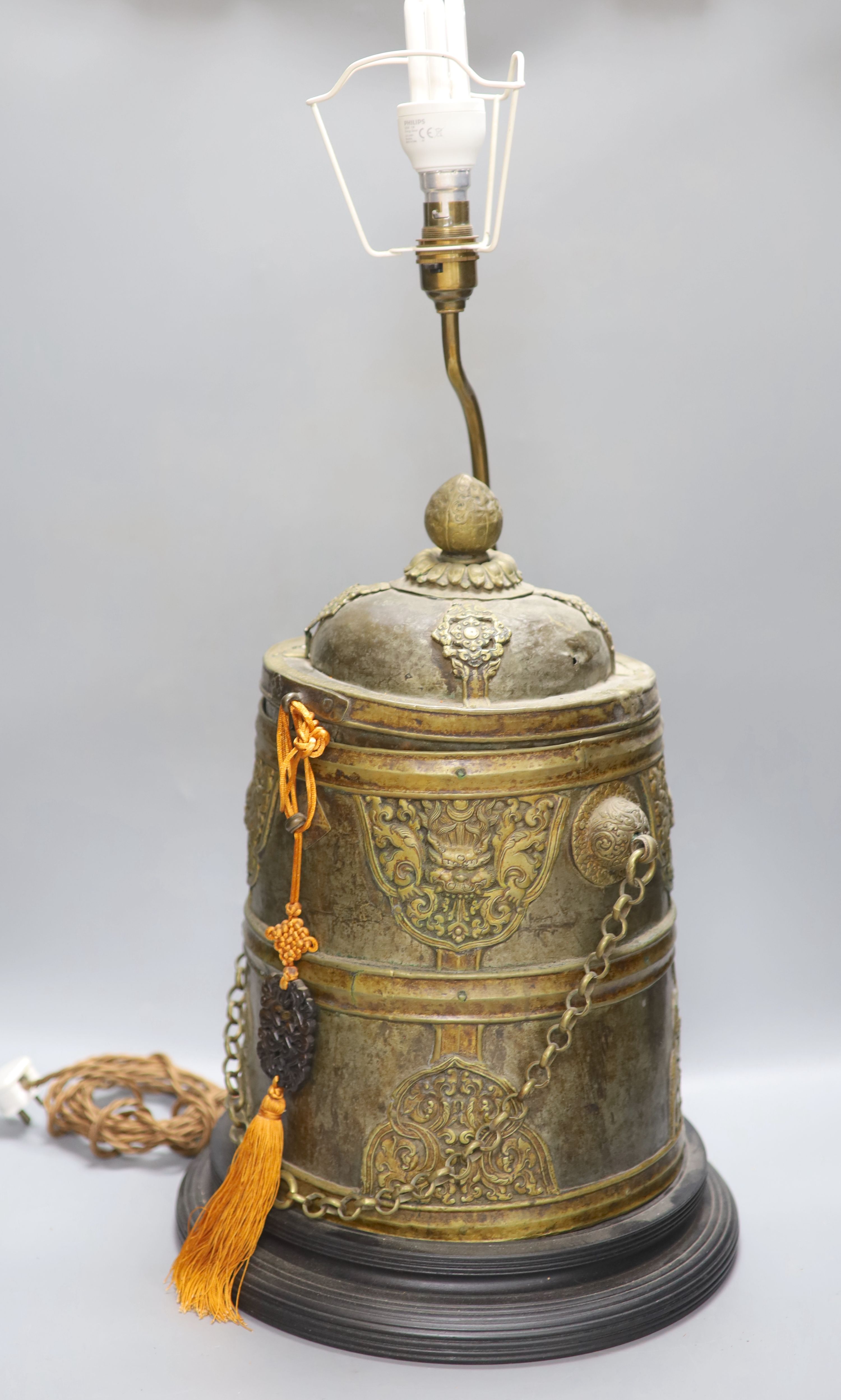 A Tibetan brass box converted lamp base, height 44cm excluding light fittings